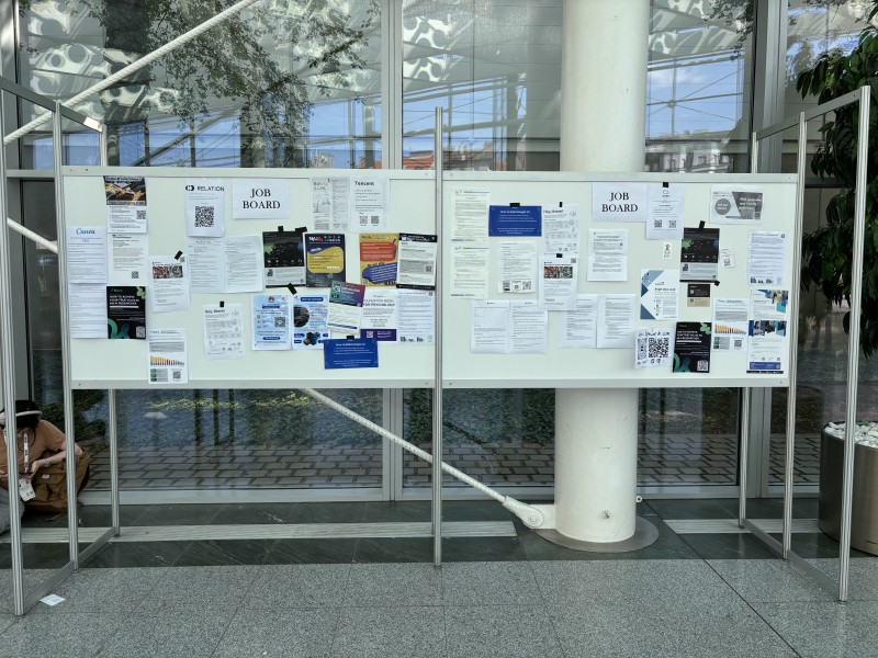 Two notice boards with job postings at ICML 2024