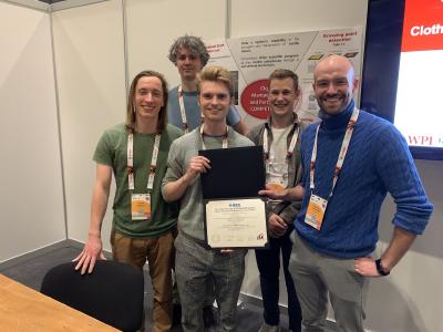 The team from Ghent holding up their winners' certificate