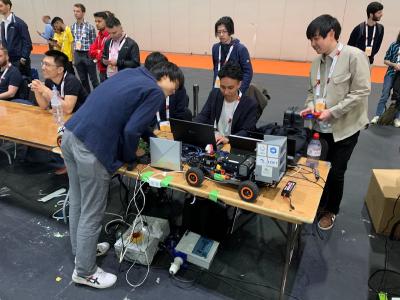 The Suzlab team making some final tweaks on their car.